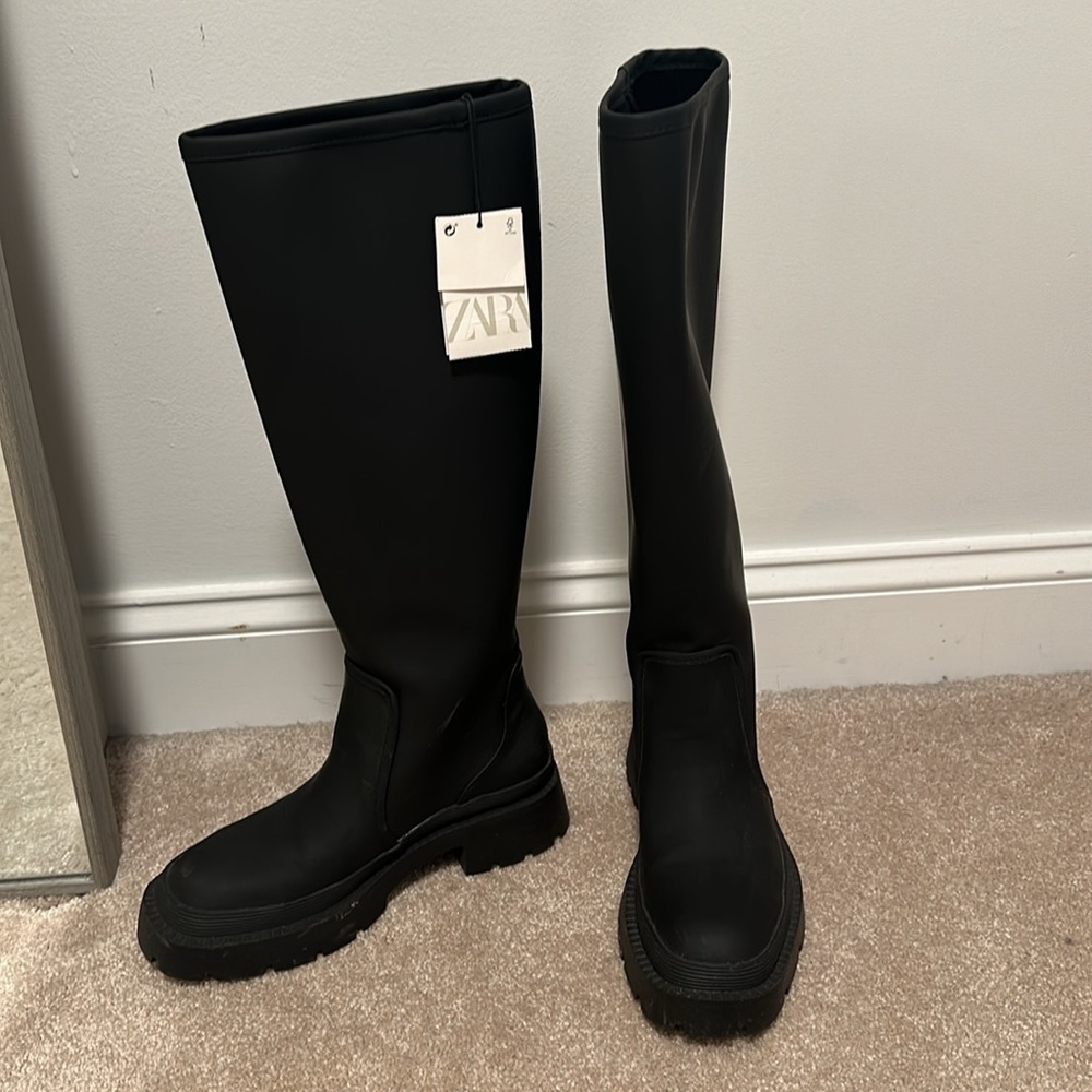 Tall black boots
